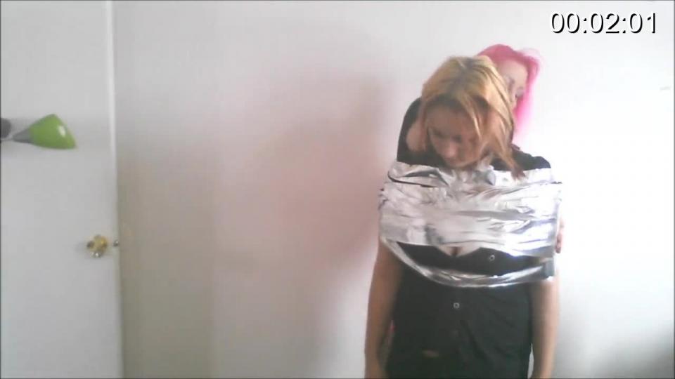 KANDY &amp; PINKIE IN- MUMMIFYING KANDY! (WMV) Best real life friends Kandy Cottentail and Pinkie have done quite a lot of kinky stuff together but they never did mummification bondage before. Pinkie wants to duct tape wrap Kandy from her shoulders and all the way down to her ankles. Kandy likes the idea and agrees to be taped up. Pinkie thoroughly tie up her best friend with both hands taped down each side of her body. Kandy is cocooned and totally helpless. Pinkie wants to gag Kandy now that she's all mummified, so she uses a pair of her worn panties to stuff in Kandy's mouth. The panties are then effectively sealed in Kandy's mouth with an amazingly tight multi-layered tape gag yanked around Kandy's pretty little head. Pinkie verbally humiliate and taunts bound and gagged Kandy before she starts whipping her with a bunch of rope. She then teases Kandy about having some more humiliation fun once the camera is off. Kandy tries to hop away in desperation but there is no way she'll ever be able escape her tight and shiny duct tape wrapture!<br><br><span style='color:#b0b0b0;'>[隐藏文字，购买后可见]</span>