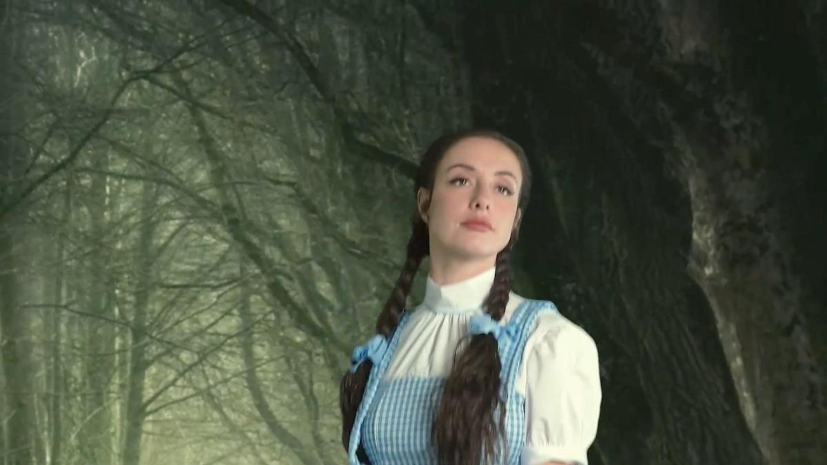Inside The Ruby Slippers (1080 mp4) It's autumn and close to Halloween. Dorothy is skipping along in the forest when all of a sudden, the wicked witch appears out of nowhere! The wicked witch wants Dorothy's ruby slippers and she's going to get them one way or another! <br><br>The witch has brought Dorothy back to her evil castle and has Dorothy bound with her feet propped up. Dorothy struggles to keep from letting the wicked witch remove her ruby slippers. However, the witch was prepared for this. She uses a freshly picked bunch of poppy flowers and gently brushes them in front of Dorothy which helps her relax her feet. The witch was then able to remove the slippers, but that's not the end of it. You see, in addition to the ruby slippers, the witch has other plans for Dorothy's big soft size 9 feet too.<br><br>This witch has a thing for the feet of beautiful . She kisses and smells the socks that Dorothy is still wearing, then she peels them off, revealing Dorothy's flawless bare soles. The witch sniffs, licks and nibbles on Dorothy's bare feet. Then she uses her fingernails to begin tickling them. The calming effect of the poppies are wearing off and Dorothy begins to respond to the witch's tickle torment and alternating foot licking and nibbling. Dorothy laughs and wiggles her feet, but the restraints keep her held securely in place. The witch then uses a brush to apply a special concocted tickling oil to the bottoms of Dorothy's sensitive feet. The witch resumes her cruel tickling and Dorothy continues to laugh and laugh and laugh.<br><br>Poor Dorothy, she just wants to go home!