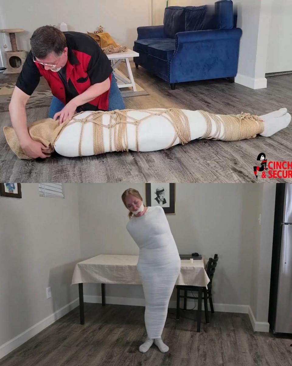 1386 - Rachel Adams - Wrapped, Roped and Helpless 雷切尔终于和她的男友分手了。 她很高兴摆脱了他，以至于忘记了换门锁。 大错！ 当她做家务时，他偷偷溜了进来，决心重修旧好。 只是这一次，他要确保她不能离开！ 他把她的身体从脚踝到脖子都用绷带紧紧包裹住，让她变成了一个无助的木乃伊！ 为了防止她惊动任何可能的救星，她把一只旧脏袜子塞进嘴里，并用施虐般的紧绷胶带堵住她的嘴，露出可怕的鬼脸！ 当他离开准备他们“和解”的最后步骤时，雷切尔开始在房间里跳来跳去，绝望地寻找某种释放自己的方法。 身体被封印在邪茧之中，她只能用鼻子拨通手机，希望接电话的人能听懂她的胡言乱语，并伸出援手！ 不幸的是，她的前男友抓住了她，并决定确保她不能动弹。 他将一根精心制作的绳索绑在她身上，直接在茧的上方！ 现在她完全被绷带、胶带和绳子囚禁，只能在恐惧和沮丧中蠕动、呻吟和咕哝！ 最后，她的男朋友回来了，用麻袋套住她的头，让她陷入黑暗！ 在漆黑的黑暗中，她能感觉到他在她的脚踝上加了更多的绳子，她的胃里充满了令人作呕的恐惧，她感觉自己被拖走了！ 当她滑过现在是她以前家的地板时，她对着嘴尖叫起来，因为她知道自己再也不会被看见了！Rachel has finally broken up with her bum of a boyfriend. She was so happy to get rid of him that she forgot all about changing the locks on her doors.  BIG MISTAKE! While she was doing housework, he sneaked in, determined to renew their relationship.  Only THIS time, he was going to make certain that she could not leave! He wrapped her body tightly from ankles to neck in excruciatingly tight bandages, transforming her into a helpless mummy! To keep her from alerting any possible saviors, her crammed an old dirty sock into her mouth and applied a sadistically tight tape gag that cleaved her mouth open in a horrible grimace! When he left to prepare the final steps for their "reconciliation", Rachel began to hop around the room desperate to find some way of freeing herself.  With her body sealed inside the wicked cocoon, all she could do was use her nose to dial her cell phone and hope that whoever answered would understand her gagged gibberish and send help! Unfortunately, her ex-boyfriend caught her and decided to make certain she could not move.  He tied an elaborate rope harness on her body directly OVER the cocoon! Now totally imprisoned in bandages, tape and rope, she could only squirm, moan and grunt in fear and frustration! Finally, her boyfriend return, slipping a sack over her head and plunging her into darkness! In the inky blackness she could feel him adding more rope around her ankle, and with sickening dread in her stomach, she felt herself being dragged away! As she slid across the floor of what was now her former home, she screamed into her gag, knowing she would never be seen again!
