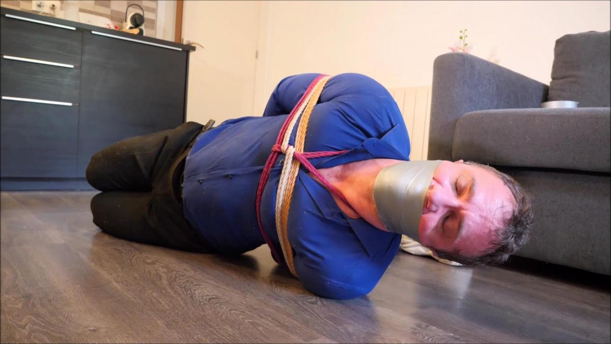 The packaged Tony (Part 2)-MP4 Description<br>Tony gets back home from work, suddenly a woman appeared and knock him out. He tried so hard to fight it off but the girl is just so strong. Tony can’t yell, mouth was completely covered and muffled while she slowly fall resting. Then Tony woke up, hands and feet are tied. Then the intruder is about to finish tying you up when you started to get senses back and tried to get attention. Now Tony has to be gagged. The girl hand gags him and still Tony fights off. The intruder got pissed and remove the dirty socks she wore all day. Shoved it to his mouth and just taped it shut. Made the threat that if Tony does not shut it up she will knock him out again and Tony knows how bad it feels to get knocked out so Tony angrily stopped. Then the woman went back to work tying you up. Now adding a tight toe-tie and more ropes to his body. Tony got very feisty and still managed to make enough sound that the woman gets really pissed off now. The woman then re-did the gag, stuffed it again and made him seal his lips shut then tape it with duct tape. Did this with many strips of tape until the you just loses hope of talking again. Now scared, Tony gets finished being tied up and gagged. Thrown into the floor and gets hogtie. The woman now explains why he is doing this. She is hired to you. Muffle pretty well and all Tony can do is moan yet the woman added more duct tape to make it even worse. Made his hogtie tighter by connecting her tied-toes/feet to his wrist/shoulder ropes. Then the woman started him by taking pictures, making fun of his bondage ordeal, tells him stories of what she does to women and men when she gets them then later sell to somewhere if not delivered to the specific customer. Where will be tied and gagged for more for maybe a couple days then returned to her place “toe-tally” fucked up. Scare him off with words such as "pretzel hogtie", thought her toe tie right now is twisted, just imaging when tighter, sucking his toes to his disgust while helplessly bound and gagged. Next is a quick phone call to arrange silently moving him without alarming people. One last fight for, before he gets taken away, all that angry gag talk yet he is still very hopeless in the floor barely can move and with every struggle more is happening to her. he gets asked if he wants to knock out again or not, of course he gets knocked out. Slowly fall resting again before he gets packaged away. (ENGLISH DIALOGUE, BONDAGE MALE, BONDAGE, ROPE BONDAGE, FEMALE DOMINATION, KNOCK OUT, ALL ROPED ON THE SCREEN, STUFFED MOUTH, TAPE GAGGED, WRAP TAPE GAGGED, HOGTIED, TOE TIED, BAREFOOT BONDAGE, GAGGED MAN, TEASING, GAG TALKING, HOME INVASION, BLOUSE OUTFIT, HD VIDEO)