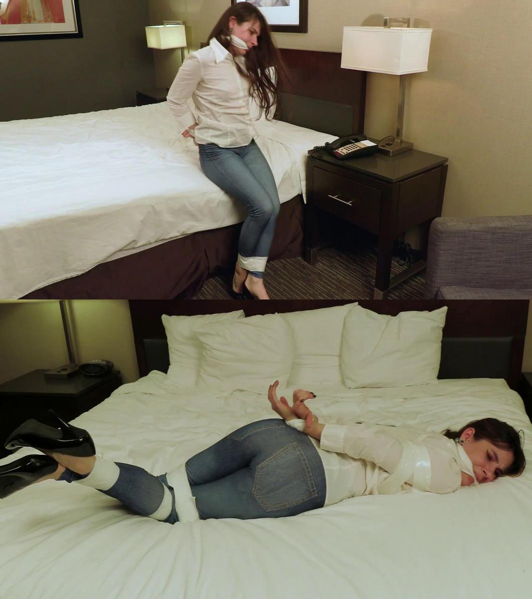 The Bondage Question - Ziva Fey 性感的齐瓦·菲 (Ziva Fey) 在这部向经典主流束缚场景致敬的影片中担任主角。 这位黑发美女扮演一名卧底间谍，以挫败危险的阴谋，但计划却严重出错。 这位性感特工的手脚都被胶带绑着，试图拖延时间，以便弄清楚自己的下一步行动。 但目前她的选择似乎相当有限。 齐瓦被转移到酒店床上并被割开嘴，并警告她保持安静，以免惹上麻烦。 但一旦只剩下她一个人，齐瓦就蠕动到床边的电话旁。 她小心地输入一个号码，然后为团队的其他成员敲出莫尔斯电码信息。 她必须迅速回到床上原来的位置以隐藏自己的努力，但当她的主人进来检查他被绑住并堵住嘴的客人时，她注意到电话听筒稍微离开了支架。 他会注意到吗？<br><br>Luscious Ziva Fey stars in this homage to a classic mainstream bondage scene. The brunette beauty plays a spy who's gone undercover to thwart a dangerous plot, but the plan goes terribly awry. The sexy agent is bound hand and foot with tape and trying to stall for time so she can figure out her next move. But her options seem rather limited at the moment. Ziva is moved onto the hotel bed and cleavegagged, and she's warned to stay quiet and out of trouble. But once she's left alone, Ziva squirms over to the bedside phone. She carefully punches in a number and then taps out a Morse code message for the rest of her team. She has to quickly get back to her original position on the bed to hide her efforts, but when her host comes in to check on his bound and gagged guest, she notices the receiver of the phone is slightly off the cradle. Will he notice it? 