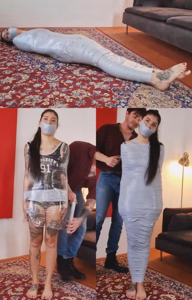 A mummification for Liricaa Liricaa 想要在木乃伊化方面取得进步，能够将她的鼻孔遮住，为此她必须先练习。<br><br>因此，Speakuss 决定帮助她，将她制成木乃伊，他首先将她的手腕绑在身体两侧，以确保她不会扭动太多。然后，他用一条大内裤堵住她的嘴，并用大量胶带封住她的嘴。之后，是时候开始木乃伊化了，他用透明薄膜包裹 Liricaa 的整个身体，然后继续用大量胶带覆盖。<br><br>当他完成后，Liricaa 完全无助，她甚至无法移动一英寸的身体。Speakuss 打了 Liricaa 几下屁股，然后离开，让 Liricaa 独自扭动。Liricaa wants to progress in her mummifications, to be able to build up to a mummification where only her nostrils are cover, and to do so she first must practice. <br><br><br>So Speakuss decides to help her and mummify her, he first tapes her wrists to her sides just to make sure she can't wiggle around to much. Then he gags her with some huge panties and loads of strips of tape over her mouth. After that it's time to start the mummification, he wraps Liricaa's whole body with transparent film and then he continues covering with loads and loads of tape. <br><br><br>When he's done, Liricaa is completely helpless, she can't even move her body a single inch. Speakuss spanks Liricaa a bit before he leaves and leaves Liricaa to squirm around alone. 